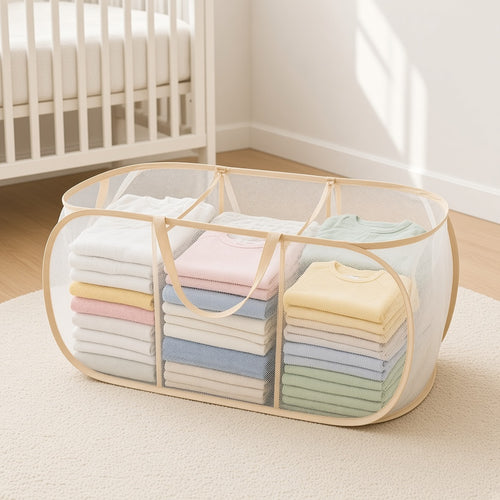 Clear three-section storage basket holding folded baby clothes in a nursery